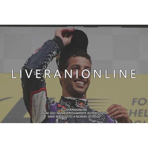 Race winner Daniel Ricciardo (AUS) Red Bull Racing celebrates on the podium. 24.08.2014. Formula 1 World Championship, Rd 12, Belgian Grand Prix, Spa Francorchamps, Belgium, Race Day. AG ALDO LIVERANI SAS ONLY ITALY