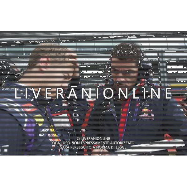 (L to R): Sebastian Vettel (GER) Red Bull Racing with Guillaume Rocquelin (ITA) Red Bull Racing Race Engineer on the grid. 24.08.2014. Formula 1 World Championship, Rd 12, Belgian Grand Prix, Spa Francorchamps, Belgium, Race Day. AG ALDO LIVERANI SAS ONLY ITALY