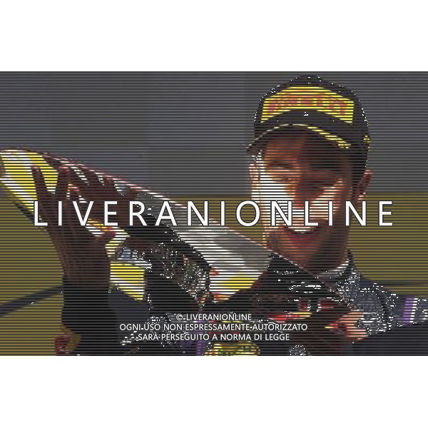 Race winner Daniel Ricciardo (AUS) Red Bull Racing celebrates on the podium. 24.08.2014. Formula 1 World Championship, Rd 12, Belgian Grand Prix, Spa Francorchamps, Belgium, Race Day. AG ALDO LIVERANI SAS ONLY ITALY