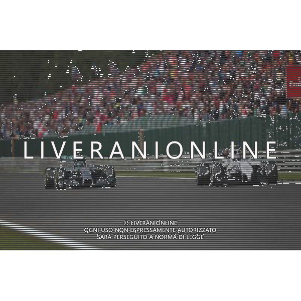 (L to R): Nico Rosberg (GER) Mercedes AMG F1 W05 and Valtteri Bottas (FIN) Williams FW36 battle for position. 24.08.2014. Formula 1 World Championship, Rd 12, Belgian Grand Prix, Spa Francorchamps, Belgium, Race Day. AG ALDO LIVERANI SAS ONLY ITALY