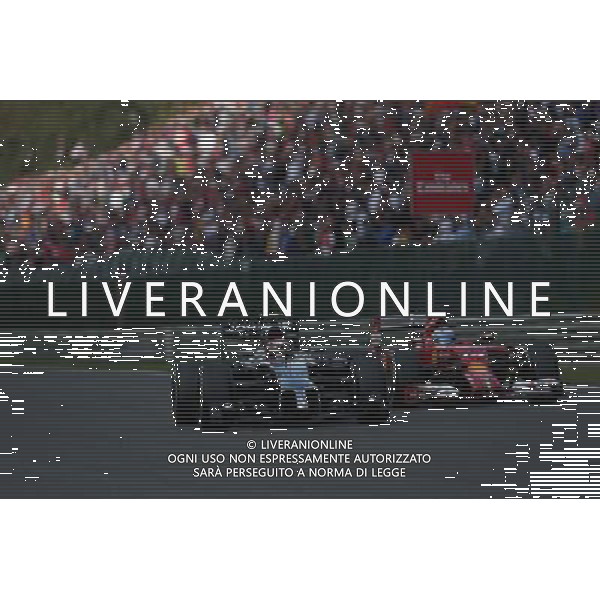Kevin Magnussen (DEN) McLaren MP4-29 and Fernando Alonso (ESP) Ferrari F14-T battle for position. 24.08.2014. Formula 1 World Championship, Rd 12, Belgian Grand Prix, Spa Francorchamps, Belgium, Race Day. AG ALDO LIVERANI SAS ONLY ITALY