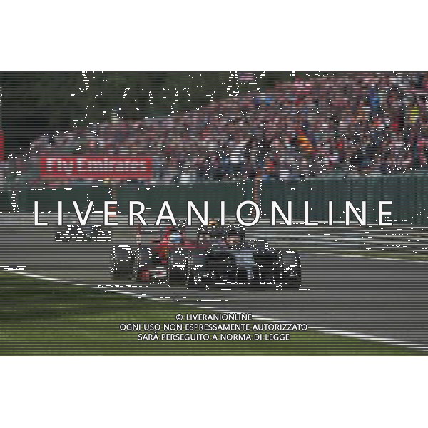 Kevin Magnussen (DEN) McLaren MP4-29 and Fernando Alonso (ESP) Ferrari F14-T battle for position. 24.08.2014. Formula 1 World Championship, Rd 12, Belgian Grand Prix, Spa Francorchamps, Belgium, Race Day. AG ALDO LIVERANI SAS ONLY ITALY