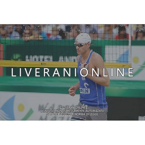24.08.2014 - Stare Jablonki , siatkowka plazowa , beach volleyball , World Tour , FIVB Stare Jablonki Grand Slam 2014 , USA (niebieskie) - Austria (czarne) , USA (blue) - Austria (black) N/Z Jacob Gibb Fot. Karol Bartnik / MPAimages.com/NEWSPIX.PL --- Newspix.pl /Agenzia Aldo Liverani sas - ITALY ONLY - EDITORIAL USE ONLY - BEACHVOLLEY *** Local Caption *** www.newspix.pl mail us: info@newspix.pl call us: 0048 022 23 22 222 --- Polish Picture Agency by Ringier Axel Springer Poland