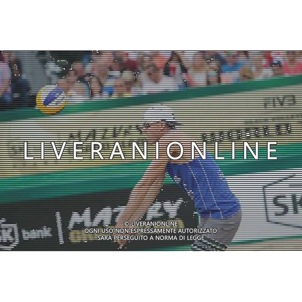 24.08.2014 - Stare Jablonki , siatkowka plazowa , beach volleyball , World Tour , FIVB Stare Jablonki Grand Slam 2014 , USA (niebieskie) - Austria (czarne) , USA (blue) - Austria (black) N/Z Jacob Gibb Fot. Karol Bartnik / MPAimages.com/NEWSPIX.PL --- Newspix.pl /Agenzia Aldo Liverani sas - ITALY ONLY - EDITORIAL USE ONLY - BEACHVOLLEY *** Local Caption *** www.newspix.pl mail us: info@newspix.pl call us: 0048 022 23 22 222 --- Polish Picture Agency by Ringier Axel Springer Poland