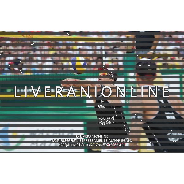 24.08.2014 - Stare Jablonki , siatkowka plazowa , beach volleyball , World Tour , FIVB Stare Jablonki Grand Slam 2014 , USA (niebieskie) - Austria (czarne) , USA (blue) - Austria (black) N/Z Alexander Horst Fot. Karol Bartnik / MPAimages.com/NEWSPIX.PL --- Newspix.pl /Agenzia Aldo Liverani sas - ITALY ONLY - EDITORIAL USE ONLY - BEACHVOLLEY *** Local Caption *** www.newspix.pl mail us: info@newspix.pl call us: 0048 022 23 22 222 --- Polish Picture Agency by Ringier Axel Springer Poland