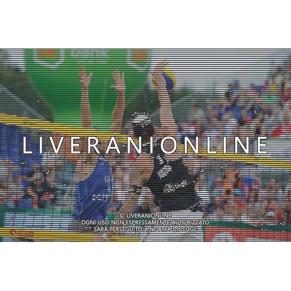 24.08.2014 - Stare Jablonki , siatkowka plazowa , beach volleyball , World Tour , FIVB Stare Jablonki Grand Slam 2014 , USA (niebieskie) - Austria (czarne) , USA (blue) - Austria (black) N/Z Casey Patterson , Clemens Doppler Fot. Karol Bartnik / MPAimages.com/NEWSPIX.PL --- Newspix.pl /Agenzia Aldo Liverani sas - ITALY ONLY - EDITORIAL USE ONLY - BEACHVOLLEY *** Local Caption *** www.newspix.pl mail us: info@newspix.pl call us: 0048 022 23 22 222 --- Polish Picture Agency by Ringier Axel Springer Poland