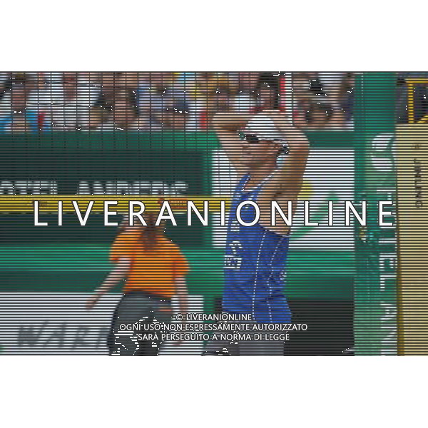 24.08.2014 - Stare Jablonki , siatkowka plazowa , beach volleyball , World Tour , FIVB Stare Jablonki Grand Slam 2014 , USA (niebieskie) - Austria (czarne) , USA (blue) - Austria (black) N/Z Jacob Gibb Fot. Karol Bartnik / MPAimages.com/NEWSPIX.PL --- Newspix.pl /Agenzia Aldo Liverani sas - ITALY ONLY - EDITORIAL USE ONLY - BEACHVOLLEY *** Local Caption *** www.newspix.pl mail us: info@newspix.pl call us: 0048 022 23 22 222 --- Polish Picture Agency by Ringier Axel Springer Poland