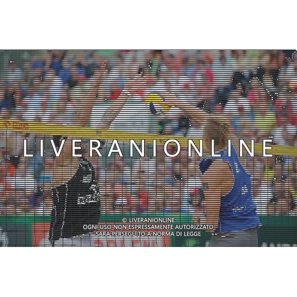 24.08.2014 - Stare Jablonki , siatkowka plazowa , beach volleyball , World Tour , FIVB Stare Jablonki Grand Slam 2014 , USA (niebieskie) - Austria (czarne) , USA (blue) - Austria (black) N/Z Clemens Doppler , Casey Patterson Fot. Karol Bartnik / MPAimages.com/NEWSPIX.PL --- Newspix.pl /Agenzia Aldo Liverani sas - ITALY ONLY - EDITORIAL USE ONLY - BEACHVOLLEY *** Local Caption *** www.newspix.pl mail us: info@newspix.pl call us: 0048 022 23 22 222 --- Polish Picture Agency by Ringier Axel Springer Poland