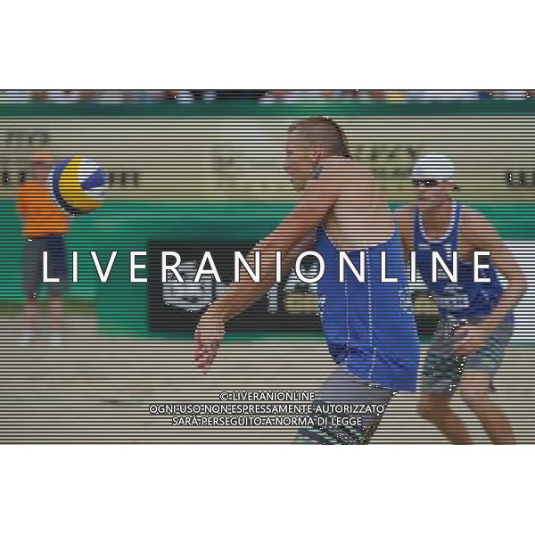 24.08.2014 - Stare Jablonki , siatkowka plazowa , beach volleyball , World Tour , FIVB Stare Jablonki Grand Slam 2014 , USA (niebieskie) - Austria (czarne) , USA (blue) - Austria (black) N/Z Casey Patterson Fot. Karol Bartnik / MPAimages.com/NEWSPIX.PL --- Newspix.pl /Agenzia Aldo Liverani sas - ITALY ONLY - EDITORIAL USE ONLY - BEACHVOLLEY *** Local Caption *** www.newspix.pl mail us: info@newspix.pl call us: 0048 022 23 22 222 --- Polish Picture Agency by Ringier Axel Springer Poland