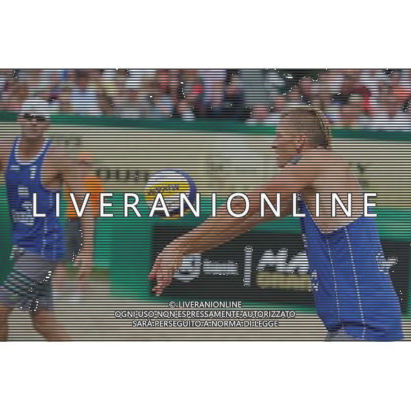 24.08.2014 - Stare Jablonki , siatkowka plazowa , beach volleyball , World Tour , FIVB Stare Jablonki Grand Slam 2014 , USA (niebieskie) - Austria (czarne) , USA (blue) - Austria (black) N/Z Casey Patterson Fot. Karol Bartnik / MPAimages.com/NEWSPIX.PL --- Newspix.pl /Agenzia Aldo Liverani sas - ITALY ONLY - EDITORIAL USE ONLY - BEACHVOLLEY *** Local Caption *** www.newspix.pl mail us: info@newspix.pl call us: 0048 022 23 22 222 --- Polish Picture Agency by Ringier Axel Springer Poland