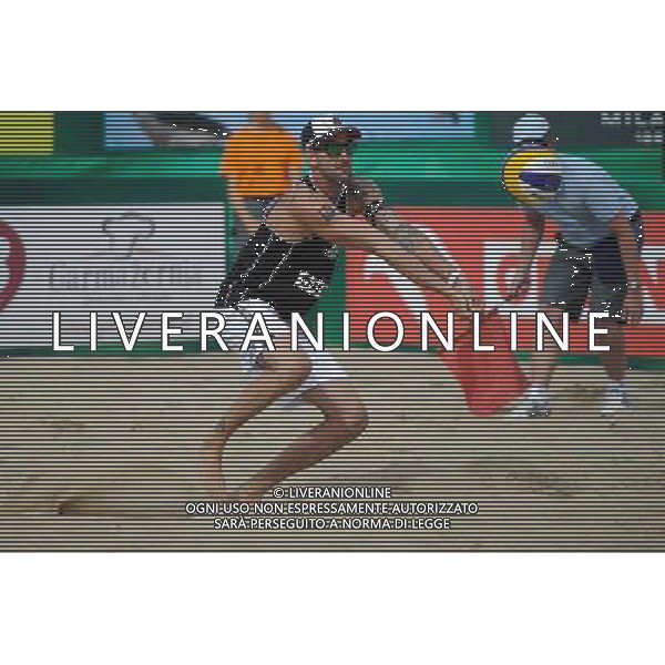 24.08.2014 - Stare Jablonki , siatkowka plazowa , beach volleyball , World Tour , FIVB Stare Jablonki Grand Slam 2014 , USA (niebieskie) - Austria (czarne) , USA (blue) - Austria (black) N/Z Clemens Doppler Fot. Karol Bartnik / MPAimages.com/NEWSPIX.PL --- Newspix.pl /Agenzia Aldo Liverani sas - ITALY ONLY - EDITORIAL USE ONLY - BEACHVOLLEY *** Local Caption *** www.newspix.pl mail us: info@newspix.pl call us: 0048 022 23 22 222 --- Polish Picture Agency by Ringier Axel Springer Poland
