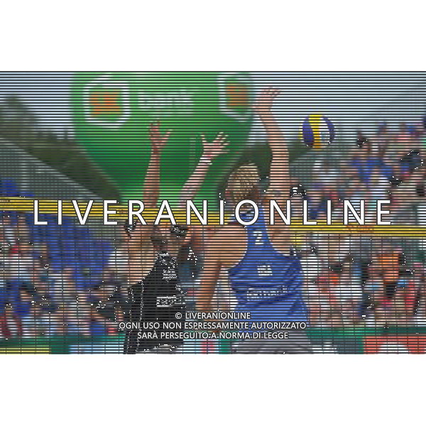 24.08.2014 - Stare Jablonki , siatkowka plazowa , beach volleyball , World Tour , FIVB Stare Jablonki Grand Slam 2014 , USA (niebieskie) - Austria (czarne) , USA (blue) - Austria (black) N/Z Clemens Doppler , Casey Patterson Fot. Karol Bartnik / MPAimages.com/NEWSPIX.PL --- Newspix.pl /Agenzia Aldo Liverani sas - ITALY ONLY - EDITORIAL USE ONLY - BEACHVOLLEY *** Local Caption *** www.newspix.pl mail us: info@newspix.pl call us: 0048 022 23 22 222 --- Polish Picture Agency by Ringier Axel Springer Poland