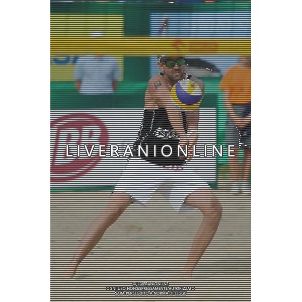 24.08.2014 - Stare Jablonki , siatkowka plazowa , beach volleyball , World Tour , FIVB Stare Jablonki Grand Slam 2014 , USA (niebieskie) - Austria (czarne) , USA (blue) - Austria (black) N/Z Clemens Doppler Fot. Karol Bartnik / MPAimages.com/NEWSPIX.PL --- Newspix.pl /Agenzia Aldo Liverani sas - ITALY ONLY - EDITORIAL USE ONLY - BEACHVOLLEY *** Local Caption *** www.newspix.pl mail us: info@newspix.pl call us: 0048 022 23 22 222 --- Polish Picture Agency by Ringier Axel Springer Poland