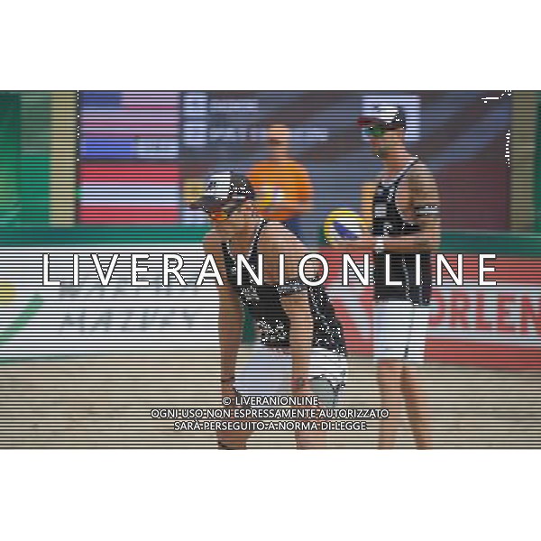 24.08.2014 - Stare Jablonki , siatkowka plazowa , beach volleyball , World Tour , FIVB Stare Jablonki Grand Slam 2014 , USA (niebieskie) - Austria (czarne) , USA (blue) - Austria (black) N/Z Alexander Horst , Clemens Doppler Fot. Karol Bartnik / MPAimages.com/NEWSPIX.PL --- Newspix.pl /Agenzia Aldo Liverani sas - ITALY ONLY - EDITORIAL USE ONLY - BEACHVOLLEY *** Local Caption *** www.newspix.pl mail us: info@newspix.pl call us: 0048 022 23 22 222 --- Polish Picture Agency by Ringier Axel Springer Poland