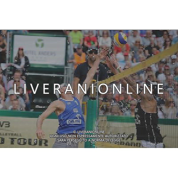 24.08.2014 - Stare Jablonki , siatkowka plazowa , beach volleyball , World Tour , FIVB Stare Jablonki Grand Slam 2014 , USA (niebieskie) - Austria (czarne) , USA (blue) - Austria (black) N/Z Jacob Gibb , Clemens Doppler Fot. Karol Bartnik / MPAimages.com/NEWSPIX.PL --- Newspix.pl /Agenzia Aldo Liverani sas - ITALY ONLY - EDITORIAL USE ONLY - BEACHVOLLEY *** Local Caption *** www.newspix.pl mail us: info@newspix.pl call us: 0048 022 23 22 222 --- Polish Picture Agency by Ringier Axel Springer Poland