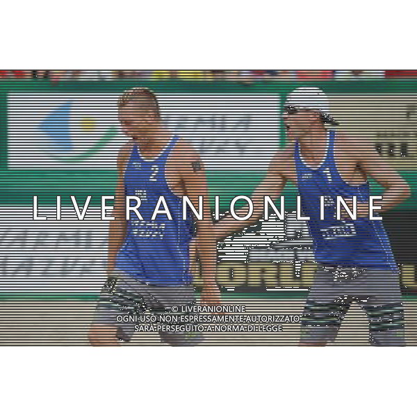 24.08.2014 - Stare Jablonki , siatkowka plazowa , beach volleyball , World Tour , FIVB Stare Jablonki Grand Slam 2014 , USA (niebieskie) - Austria (czarne) , USA (blue) - Austria (black) N/Z Casey Patterson , Jacob Gibb Fot. Karol Bartnik / MPAimages.com/NEWSPIX.PL --- Newspix.pl /Agenzia Aldo Liverani sas - ITALY ONLY - EDITORIAL USE ONLY - BEACHVOLLEY *** Local Caption *** www.newspix.pl mail us: info@newspix.pl call us: 0048 022 23 22 222 --- Polish Picture Agency by Ringier Axel Springer Poland