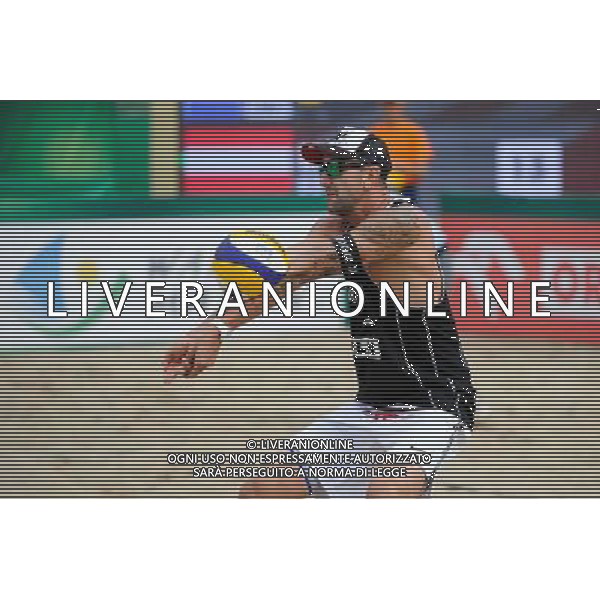 24.08.2014 - Stare Jablonki , siatkowka plazowa , beach volleyball , World Tour , FIVB Stare Jablonki Grand Slam 2014 , USA (niebieskie) - Austria (czarne) , USA (blue) - Austria (black) N/Z Clemens Doppler Fot. Karol Bartnik / MPAimages.com/NEWSPIX.PL --- Newspix.pl /Agenzia Aldo Liverani sas - ITALY ONLY - EDITORIAL USE ONLY - BEACHVOLLEY *** Local Caption *** www.newspix.pl mail us: info@newspix.pl call us: 0048 022 23 22 222 --- Polish Picture Agency by Ringier Axel Springer Poland
