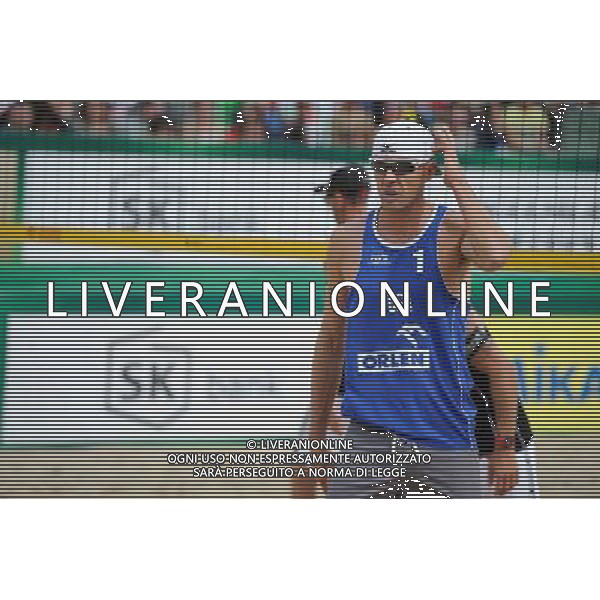24.08.2014 - Stare Jablonki , siatkowka plazowa , beach volleyball , World Tour , FIVB Stare Jablonki Grand Slam 2014 , USA (niebieskie) - Austria (czarne) , USA (blue) - Austria (black) N/Z Jacob Gibb Fot. Karol Bartnik / MPAimages.com/NEWSPIX.PL --- Newspix.pl /Agenzia Aldo Liverani sas - ITALY ONLY - EDITORIAL USE ONLY - BEACHVOLLEY *** Local Caption *** www.newspix.pl mail us: info@newspix.pl call us: 0048 022 23 22 222 --- Polish Picture Agency by Ringier Axel Springer Poland