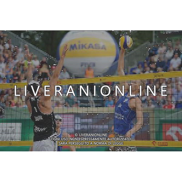 24.08.2014 - Stare Jablonki , siatkowka plazowa , beach volleyball , World Tour , FIVB Stare Jablonki Grand Slam 2014 , USA (niebieskie) - Austria (czarne) , USA (blue) - Austria (black) N/Z Clemens Doppler , Casey Patterson Fot. Karol Bartnik / MPAimages.com/NEWSPIX.PL --- Newspix.pl /Agenzia Aldo Liverani sas - ITALY ONLY - EDITORIAL USE ONLY - BEACHVOLLEY *** Local Caption *** www.newspix.pl mail us: info@newspix.pl call us: 0048 022 23 22 222 --- Polish Picture Agency by Ringier Axel Springer Poland