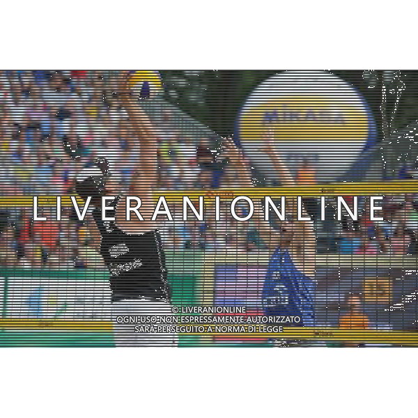 24.08.2014 - Stare Jablonki , siatkowka plazowa , beach volleyball , World Tour , FIVB Stare Jablonki Grand Slam 2014 , USA (niebieskie) - Austria (czarne) , USA (blue) - Austria (black) N/Z Alexander Horst , Jacob Gibb Fot. Karol Bartnik / MPAimages.com/NEWSPIX.PL --- Newspix.pl /Agenzia Aldo Liverani sas - ITALY ONLY - EDITORIAL USE ONLY - BEACHVOLLEY *** Local Caption *** www.newspix.pl mail us: info@newspix.pl call us: 0048 022 23 22 222 --- Polish Picture Agency by Ringier Axel Springer Poland