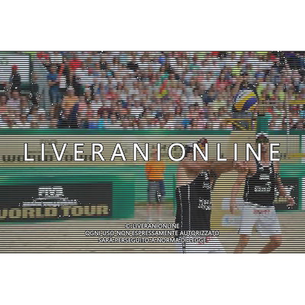 24.08.2014 - Stare Jablonki , siatkowka plazowa , beach volleyball , World Tour , FIVB Stare Jablonki Grand Slam 2014 , USA (niebieskie) - Austria (czarne) , USA (blue) - Austria (black) N/Z Alexander Horst , Clemens Doppler Fot. Karol Bartnik / MPAimages.com/NEWSPIX.PL --- Newspix.pl /Agenzia Aldo Liverani sas - ITALY ONLY - EDITORIAL USE ONLY - BEACHVOLLEY *** Local Caption *** www.newspix.pl mail us: info@newspix.pl call us: 0048 022 23 22 222 --- Polish Picture Agency by Ringier Axel Springer Poland