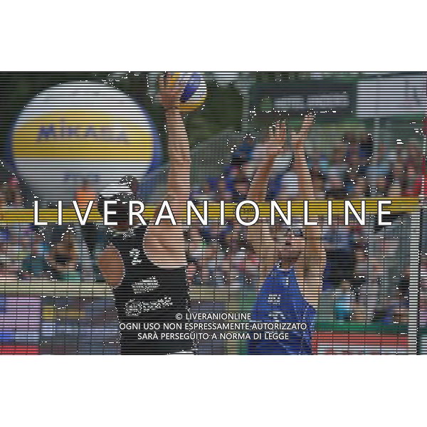 24.08.2014 - Stare Jablonki , siatkowka plazowa , beach volleyball , World Tour , FIVB Stare Jablonki Grand Slam 2014 , USA (niebieskie) - Austria (czarne) , USA (blue) - Austria (black) N/Z Alexander Horst , Jacob Gibb Fot. Karol Bartnik / MPAimages.com/NEWSPIX.PL --- Newspix.pl /Agenzia Aldo Liverani sas - ITALY ONLY - EDITORIAL USE ONLY - BEACHVOLLEY *** Local Caption *** www.newspix.pl mail us: info@newspix.pl call us: 0048 022 23 22 222 --- Polish Picture Agency by Ringier Axel Springer Poland