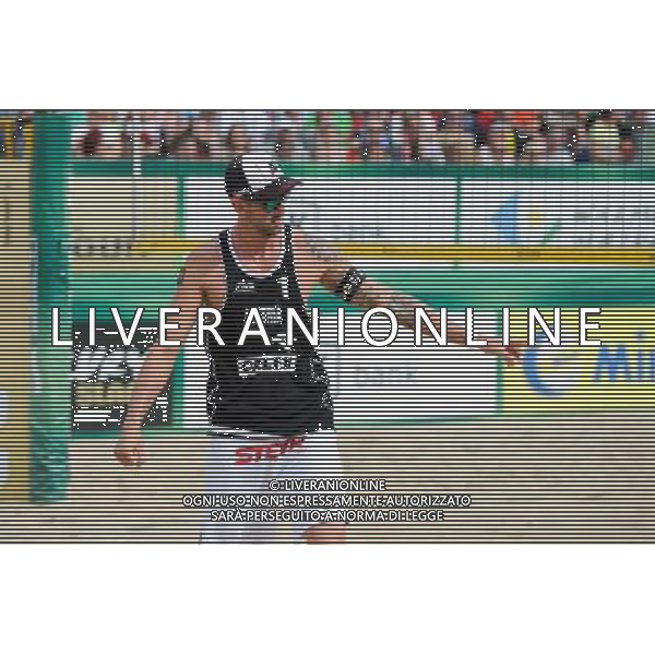 24.08.2014 - Stare Jablonki , siatkowka plazowa , beach volleyball , World Tour , FIVB Stare Jablonki Grand Slam 2014 , USA (niebieskie) - Austria (czarne) , USA (blue) - Austria (black) N/Z Clemens Doppler Fot. Karol Bartnik / MPAimages.com/NEWSPIX.PL --- Newspix.pl /Agenzia Aldo Liverani sas - ITALY ONLY - EDITORIAL USE ONLY - BEACHVOLLEY *** Local Caption *** www.newspix.pl mail us: info@newspix.pl call us: 0048 022 23 22 222 --- Polish Picture Agency by Ringier Axel Springer Poland