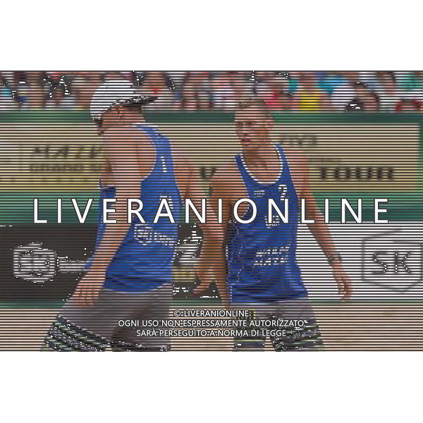 24.08.2014 - Stare Jablonki , siatkowka plazowa , beach volleyball , World Tour , FIVB Stare Jablonki Grand Slam 2014 , USA (granatowe) - Austria (czarne) , USA - Austria N/Z Jacob Gibb , Casey Patterson Fot. Mariusz Palczynski / MPAimages.com/NEWSPIX.PL --- Newspix.pl /Agenzia Aldo Liverani sas - ITALY ONLY - EDITORIAL USE ONLY - BEACHVOLLEY *** Local Caption *** www.newspix.pl mail us: info@newspix.pl call us: 0048 022 23 22 222 --- Polish Picture Agency by Ringier Axel Springer Poland