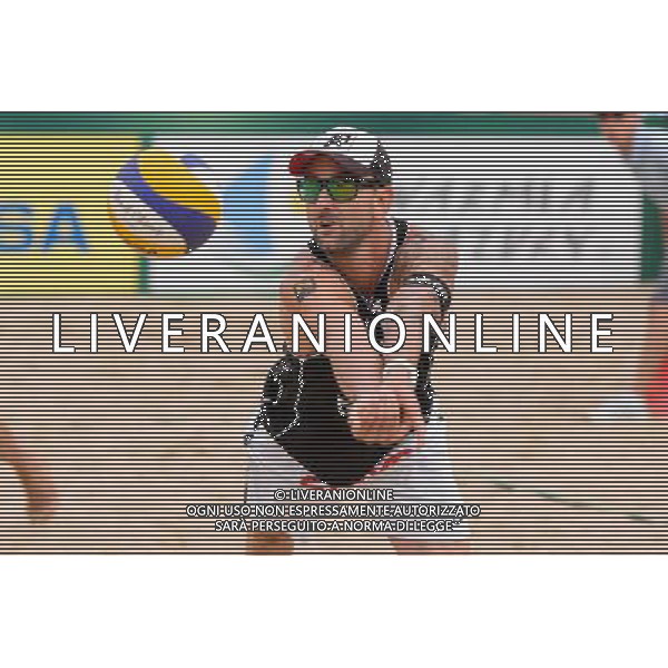 24.08.2014 - Stare Jablonki , siatkowka plazowa , beach volleyball , World Tour , FIVB Stare Jablonki Grand Slam 2014 , USA (granatowe) - Austria (czarne) , USA - Austria N/Z Clemens Doppler Fot. Mariusz Palczynski / MPAimages.com/NEWSPIX.PL --- Newspix.pl /Agenzia Aldo Liverani sas - ITALY ONLY - EDITORIAL USE ONLY - BEACHVOLLEY *** Local Caption *** www.newspix.pl mail us: info@newspix.pl call us: 0048 022 23 22 222 --- Polish Picture Agency by Ringier Axel Springer Poland