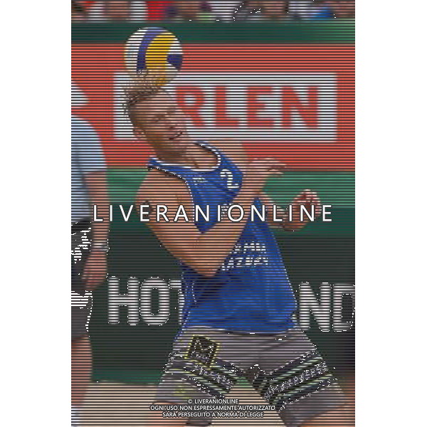 24.08.2014 - Stare Jablonki , siatkowka plazowa , beach volleyball , World Tour , FIVB Stare Jablonki Grand Slam 2014 , USA (granatowe) - Austria (czarne) , USA - Austria N/Z Casey Patterson Fot. Mariusz Palczynski / MPAimages.com/NEWSPIX.PL --- Newspix.pl /Agenzia Aldo Liverani sas - ITALY ONLY - EDITORIAL USE ONLY - BEACHVOLLEY *** Local Caption *** www.newspix.pl mail us: info@newspix.pl call us: 0048 022 23 22 222 --- Polish Picture Agency by Ringier Axel Springer Poland