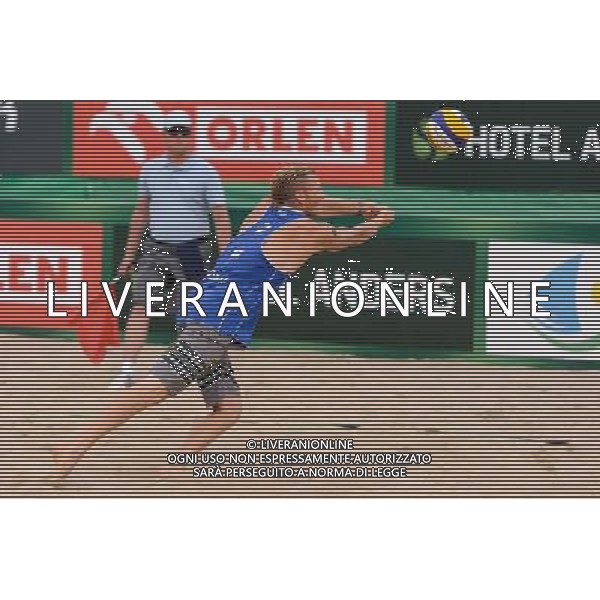 24.08.2014 - Stare Jablonki , siatkowka plazowa , beach volleyball , World Tour , FIVB Stare Jablonki Grand Slam 2014 , USA (granatowe) - Austria (czarne) , USA - Austria N/Z Casey Patterson Fot. Mariusz Palczynski / MPAimages.com/NEWSPIX.PL --- Newspix.pl /Agenzia Aldo Liverani sas - ITALY ONLY - EDITORIAL USE ONLY - BEACHVOLLEY *** Local Caption *** www.newspix.pl mail us: info@newspix.pl call us: 0048 022 23 22 222 --- Polish Picture Agency by Ringier Axel Springer Poland