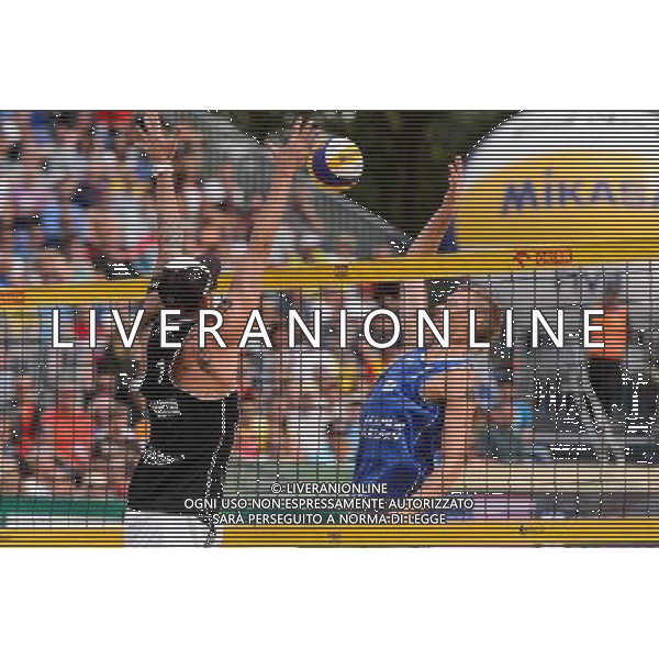 24.08.2014 - Stare Jablonki , siatkowka plazowa , beach volleyball , World Tour , FIVB Stare Jablonki Grand Slam 2014 , USA (granatowe) - Austria (czarne) , USA - Austria N/Z Clemens Doppler , Casey Patterson Fot. Mariusz Palczynski / MPAimages.com/NEWSPIX.PL --- Newspix.pl /Agenzia Aldo Liverani sas - ITALY ONLY - EDITORIAL USE ONLY - BEACHVOLLEY *** Local Caption *** www.newspix.pl mail us: info@newspix.pl call us: 0048 022 23 22 222 --- Polish Picture Agency by Ringier Axel Springer Poland