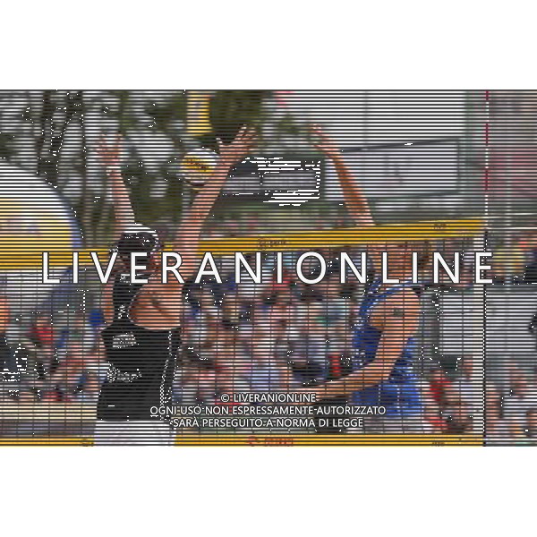 24.08.2014 - Stare Jablonki , siatkowka plazowa , beach volleyball , World Tour , FIVB Stare Jablonki Grand Slam 2014 , USA (granatowe) - Austria (czarne) , USA - Austria N/Z Clemens Doppler , Casey Patterson Fot. Mariusz Palczynski / MPAimages.com/NEWSPIX.PL --- Newspix.pl /Agenzia Aldo Liverani sas - ITALY ONLY - EDITORIAL USE ONLY - BEACHVOLLEY *** Local Caption *** www.newspix.pl mail us: info@newspix.pl call us: 0048 022 23 22 222 --- Polish Picture Agency by Ringier Axel Springer Poland