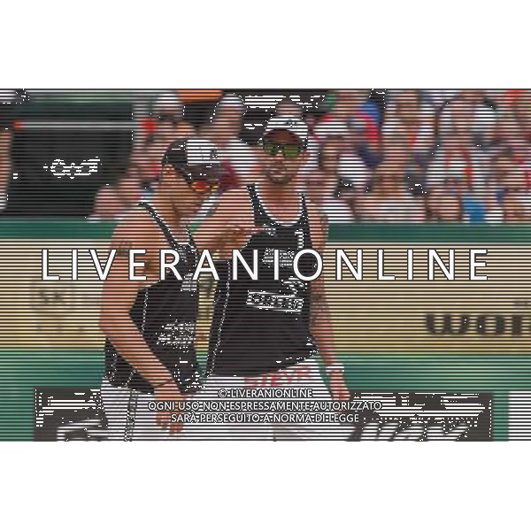 24.08.2014 - Stare Jablonki , siatkowka plazowa , beach volleyball , World Tour , FIVB Stare Jablonki Grand Slam 2014 , USA (granatowe) - Austria (czarne) , USA - Austria N/Z Alexander Horst , Clemens Doppler Fot. Mariusz Palczynski / MPAimages.com/NEWSPIX.PL --- Newspix.pl /Agenzia Aldo Liverani sas - ITALY ONLY - EDITORIAL USE ONLY - BEACHVOLLEY *** Local Caption *** www.newspix.pl mail us: info@newspix.pl call us: 0048 022 23 22 222 --- Polish Picture Agency by Ringier Axel Springer Poland