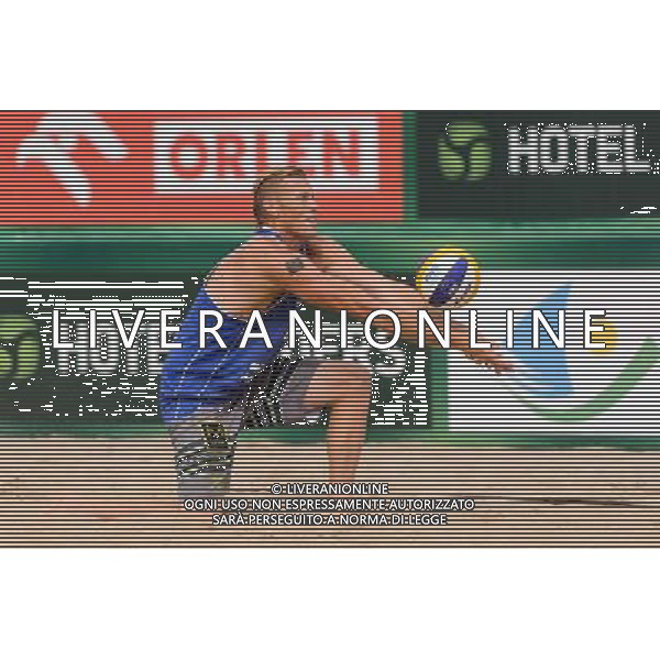 24.08.2014 - Stare Jablonki , siatkowka plazowa , beach volleyball , World Tour , FIVB Stare Jablonki Grand Slam 2014 , USA (granatowe) - Austria (czarne) , USA - Austria N/Z Casey Patterson Fot. Mariusz Palczynski / MPAimages.com/NEWSPIX.PL --- Newspix.pl /Agenzia Aldo Liverani sas - ITALY ONLY - EDITORIAL USE ONLY - BEACHVOLLEY *** Local Caption *** www.newspix.pl mail us: info@newspix.pl call us: 0048 022 23 22 222 --- Polish Picture Agency by Ringier Axel Springer Poland