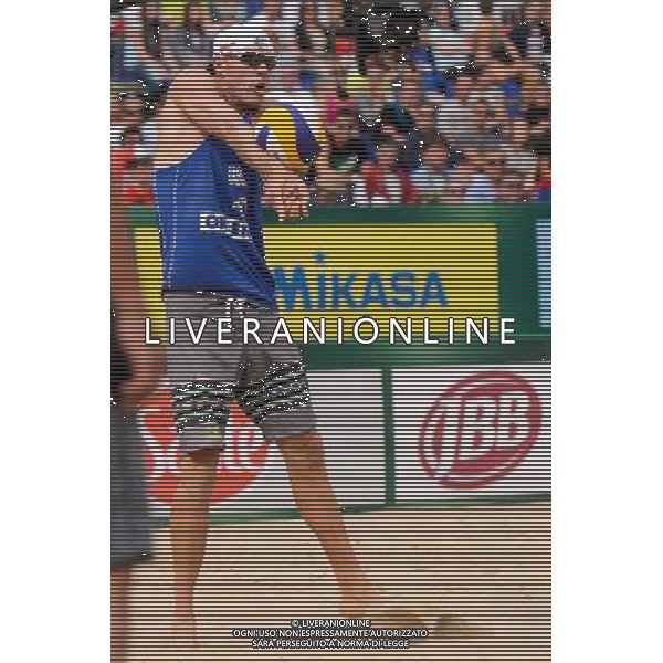 24.08.2014 - Stare Jablonki , siatkowka plazowa , beach volleyball , World Tour , FIVB Stare Jablonki Grand Slam 2014 , USA (granatowe) - Austria (czarne) , USA - Austria N/Z Jacob Gibb Fot. Mariusz Palczynski / MPAimages.com/NEWSPIX.PL --- Newspix.pl /Agenzia Aldo Liverani sas - ITALY ONLY - EDITORIAL USE ONLY - BEACHVOLLEY *** Local Caption *** www.newspix.pl mail us: info@newspix.pl call us: 0048 022 23 22 222 --- Polish Picture Agency by Ringier Axel Springer Poland