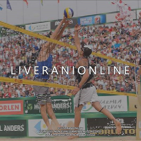 24.08.2014 - Stare Jablonki , siatkowka plazowa , beach volleyball , World Tour , FIVB Stare Jablonki Grand Slam 2014 , USA (granatowe) - Austria (czarne) , USA - Austria N/Z Jacob Gibb , Alexander Horst Fot. Mariusz Palczynski / MPAimages.com/NEWSPIX.PL --- Newspix.pl /Agenzia Aldo Liverani sas - ITALY ONLY - EDITORIAL USE ONLY - BEACHVOLLEY *** Local Caption *** www.newspix.pl mail us: info@newspix.pl call us: 0048 022 23 22 222 --- Polish Picture Agency by Ringier Axel Springer Poland