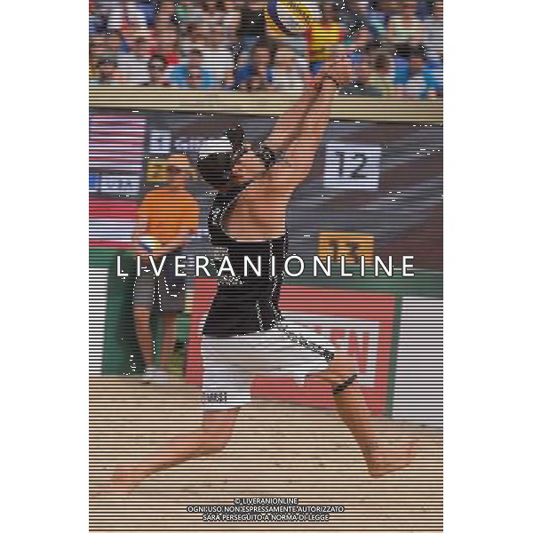 24.08.2014 - Stare Jablonki , siatkowka plazowa , beach volleyball , World Tour , FIVB Stare Jablonki Grand Slam 2014 , USA (granatowe) - Austria (czarne) , USA - Austria N/Z Alexander Horst Fot. Mariusz Palczynski / MPAimages.com/NEWSPIX.PL --- Newspix.pl /Agenzia Aldo Liverani sas - ITALY ONLY - EDITORIAL USE ONLY - BEACHVOLLEY *** Local Caption *** www.newspix.pl mail us: info@newspix.pl call us: 0048 022 23 22 222 --- Polish Picture Agency by Ringier Axel Springer Poland