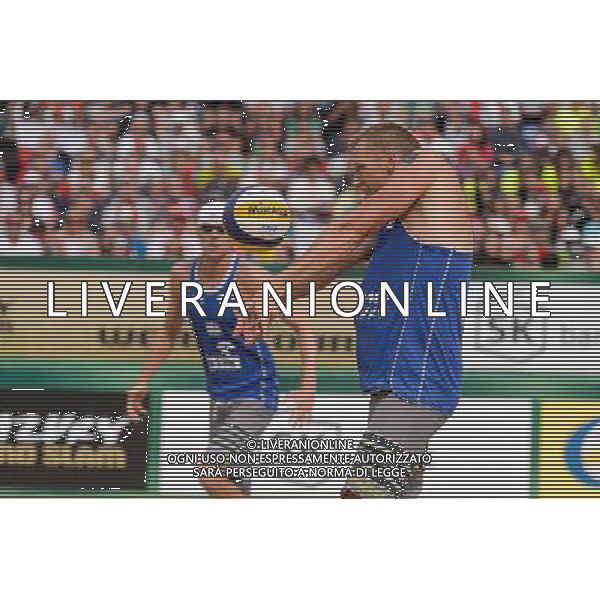 24.08.2014 - Stare Jablonki , siatkowka plazowa , beach volleyball , World Tour , FIVB Stare Jablonki Grand Slam 2014 , USA (granatowe) - Austria (czarne) , USA - Austria N/Z Casey Patterson Fot. Mariusz Palczynski / MPAimages.com/NEWSPIX.PL --- Newspix.pl /Agenzia Aldo Liverani sas - ITALY ONLY - EDITORIAL USE ONLY - BEACHVOLLEY *** Local Caption *** www.newspix.pl mail us: info@newspix.pl call us: 0048 022 23 22 222 --- Polish Picture Agency by Ringier Axel Springer Poland