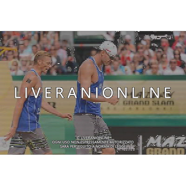 24.08.2014 - Stare Jablonki , siatkowka plazowa , beach volleyball , World Tour , FIVB Stare Jablonki Grand Slam 2014 , USA (granatowe) - Austria (czarne) , USA - Austria N/Z Casey Patterson , Jacob Gibb Fot. Mariusz Palczynski / MPAimages.com/NEWSPIX.PL --- Newspix.pl /Agenzia Aldo Liverani sas - ITALY ONLY - EDITORIAL USE ONLY - BEACHVOLLEY *** Local Caption *** www.newspix.pl mail us: info@newspix.pl call us: 0048 022 23 22 222 --- Polish Picture Agency by Ringier Axel Springer Poland