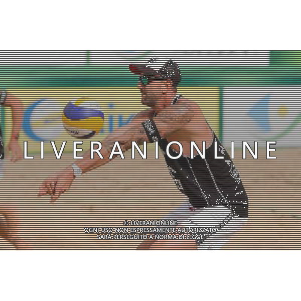 24.08.2014 - Stare Jablonki , siatkowka plazowa , beach volleyball , World Tour , FIVB Stare Jablonki Grand Slam 2014 , USA (granatowe) - Austria (czarne) , USA - Austria N/Z Clemens Doppler Fot. Mariusz Palczynski / MPAimages.com/NEWSPIX.PL --- Newspix.pl /Agenzia Aldo Liverani sas - ITALY ONLY - EDITORIAL USE ONLY - BEACHVOLLEY *** Local Caption *** www.newspix.pl mail us: info@newspix.pl call us: 0048 022 23 22 222 --- Polish Picture Agency by Ringier Axel Springer Poland