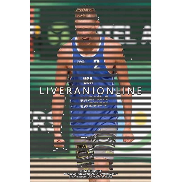 24.08.2014 - Stare Jablonki , siatkowka plazowa , beach volleyball , World Tour , FIVB Stare Jablonki Grand Slam 2014 , USA (granatowe) - Austria (czarne) , USA - Austria N/Z Casey Patterson Fot. Mariusz Palczynski / MPAimages.com/NEWSPIX.PL --- Newspix.pl /Agenzia Aldo Liverani sas - ITALY ONLY - EDITORIAL USE ONLY - BEACHVOLLEY *** Local Caption *** www.newspix.pl mail us: info@newspix.pl call us: 0048 022 23 22 222 --- Polish Picture Agency by Ringier Axel Springer Poland