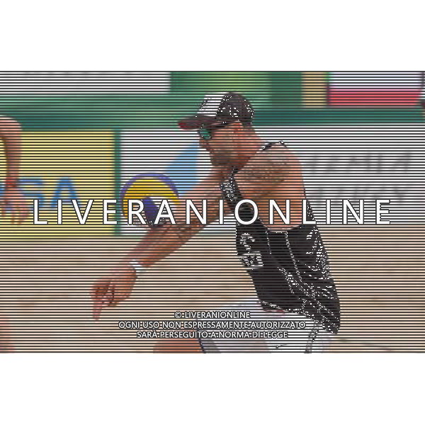 24.08.2014 - Stare Jablonki , siatkowka plazowa , beach volleyball , World Tour , FIVB Stare Jablonki Grand Slam 2014 , USA (granatowe) - Austria (czarne) , USA - Austria N/Z Clemens Doppler Fot. Mariusz Palczynski / MPAimages.com/NEWSPIX.PL --- Newspix.pl /Agenzia Aldo Liverani sas - ITALY ONLY - EDITORIAL USE ONLY - BEACHVOLLEY *** Local Caption *** www.newspix.pl mail us: info@newspix.pl call us: 0048 022 23 22 222 --- Polish Picture Agency by Ringier Axel Springer Poland