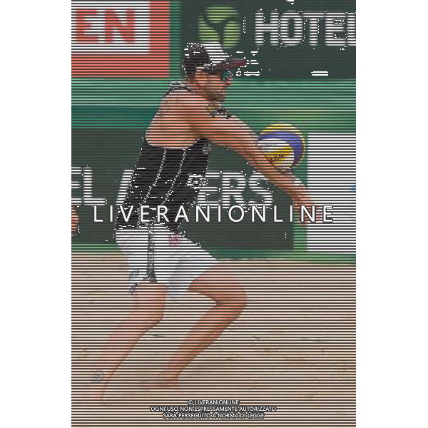 24.08.2014 - Stare Jablonki , siatkowka plazowa , beach volleyball , World Tour , FIVB Stare Jablonki Grand Slam 2014 , USA (granatowe) - Austria (czarne) , USA - Austria N/Z Clemens Doppler Fot. Mariusz Palczynski / MPAimages.com/NEWSPIX.PL --- Newspix.pl /Agenzia Aldo Liverani sas - ITALY ONLY - EDITORIAL USE ONLY - BEACHVOLLEY *** Local Caption *** www.newspix.pl mail us: info@newspix.pl call us: 0048 022 23 22 222 --- Polish Picture Agency by Ringier Axel Springer Poland