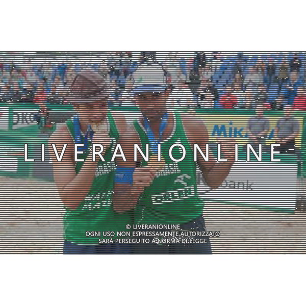 24.08.2014 - Stare Jablonki , siatkowka plazowa , beach volleyball , World Tour , FIVB Stare Jablonki Grand Slam 2014 , Dekoracja N/Z Alvaro Morais Filho , Perdo Solberg Salgado Fot. Karol Bartnik / MPAimages.com/NEWSPIX.PL --- Newspix.pl /Agenzia Aldo Liverani sas - ITALY ONLY - EDITORIAL USE ONLY - BEACHVOLLEY PREMIAZIONI *** Local Caption *** www.newspix.pl mail us: info@newspix.pl call us: 0048 022 23 22 222 --- Polish Picture Agency by Ringier Axel Springer Poland