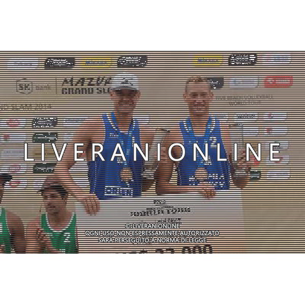 24.08.2014 - Stare Jablonki , siatkowka plazowa , beach volleyball , World Tour , FIVB Stare Jablonki Grand Slam 2014 , Dekoracja mezczyzn N/Z Jacob Gibb , Casey Patterson Fot. Mariusz Palczynski / MPAimages.com/NEWSPIX.PL --- Newspix.pl /Agenzia Aldo Liverani sas - ITALY ONLY - EDITORIAL USE ONLY - BEACHVOLLEY PREMIAZIONI *** Local Caption *** www.newspix.pl mail us: info@newspix.pl call us: 0048 022 23 22 222 --- Polish Picture Agency by Ringier Axel Springer Poland