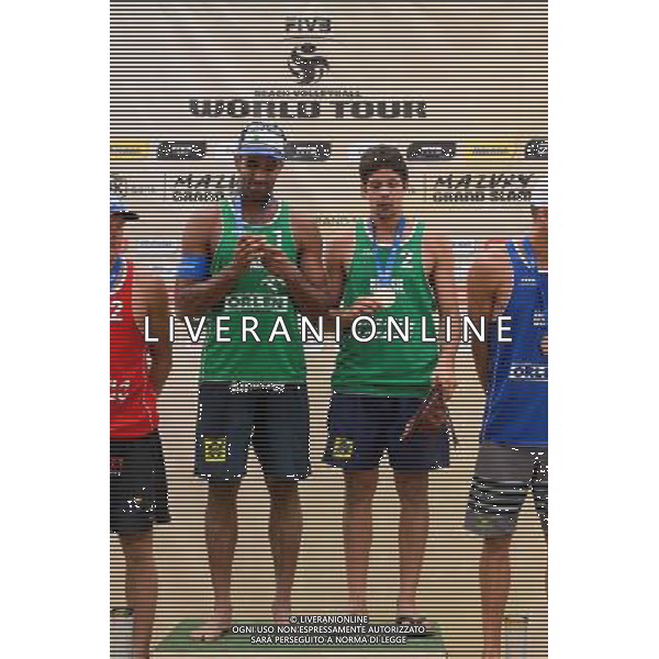 24.08.2014 - Stare Jablonki , siatkowka plazowa , beach volleyball , World Tour , FIVB Stare Jablonki Grand Slam 2014 , Dekoracja mezczyzn N/Z Pedro Solberg Salgado , Alvaro Morais Filho Fot. Mariusz Palczynski / MPAimages.com/NEWSPIX.PL --- Newspix.pl /Agenzia Aldo Liverani sas - ITALY ONLY - EDITORIAL USE ONLY - BEACHVOLLEY PREMIAZIONI *** Local Caption *** www.newspix.pl mail us: info@newspix.pl call us: 0048 022 23 22 222 --- Polish Picture Agency by Ringier Axel Springer Poland