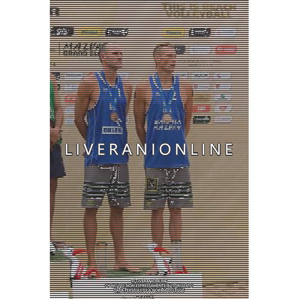 24.08.2014 - Stare Jablonki , siatkowka plazowa , beach volleyball , World Tour , FIVB Stare Jablonki Grand Slam 2014 , Dekoracja mezczyzn N/Z Jacob Gibb , Casey Patterson Fot. Mariusz Palczynski / MPAimages.com/NEWSPIX.PL --- Newspix.pl /Agenzia Aldo Liverani sas - ITALY ONLY - EDITORIAL USE ONLY - BEACHVOLLEY PREMIAZIONI *** Local Caption *** www.newspix.pl mail us: info@newspix.pl call us: 0048 022 23 22 222 --- Polish Picture Agency by Ringier Axel Springer Poland
