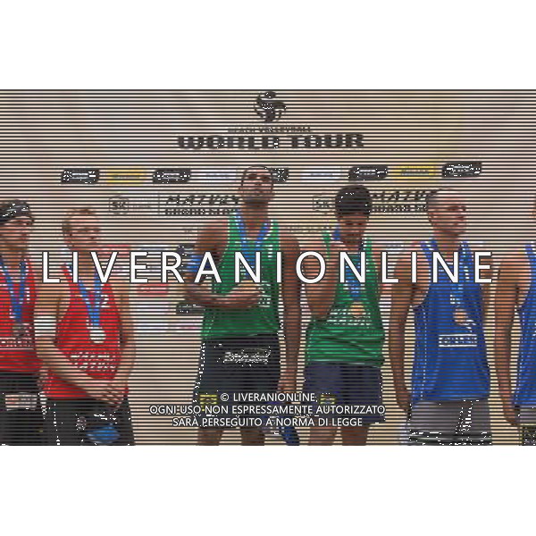 24.08.2014 - Stare Jablonki , siatkowka plazowa , beach volleyball , World Tour , FIVB Stare Jablonki Grand Slam 2014 , Dekoracja mezczyzn N/Z Aleksandrs Samoilovs , Janis Smedins , Pedro Solberg Salgado , Alvaro Morais Filho , Jacob Gibb Fot. Mariusz Palczynski / MPAimages.com/NEWSPIX.PL --- Newspix.pl /Agenzia Aldo Liverani sas - ITALY ONLY - EDITORIAL USE ONLY - BEACHVOLLEY PREMIAZIONI *** Local Caption *** www.newspix.pl mail us: info@newspix.pl call us: 0048 022 23 22 222 --- Polish Picture Agency by Ringier Axel Springer Poland