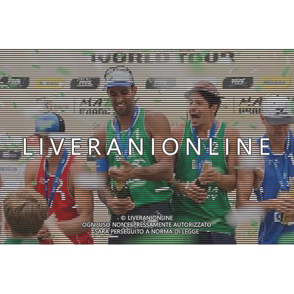 24.08.2014 - Stare Jablonki , siatkowka plazowa , beach volleyball , World Tour , FIVB Stare Jablonki Grand Slam 2014 , Dekoracja mezczyzn N/Z Pedro Solberg Salgado , Alvaro Morais Filho Fot. Mariusz Palczynski / MPAimages.com/NEWSPIX.PL --- Newspix.pl /Agenzia Aldo Liverani sas - ITALY ONLY - EDITORIAL USE ONLY - BEACHVOLLEY PREMIAZIONI *** Local Caption *** www.newspix.pl mail us: info@newspix.pl call us: 0048 022 23 22 222 --- Polish Picture Agency by Ringier Axel Springer Poland
